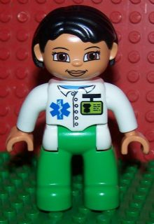 Duplo Figure Lego Ville, Female Medic, Bright Green Legs, White Top with ID Badge and EMT Star of Life Pattern, Black Hair, Brown Eyes